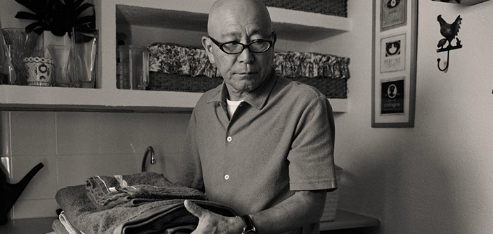 Man holding towels