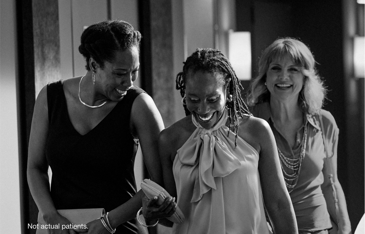 Woman laughing together with friends