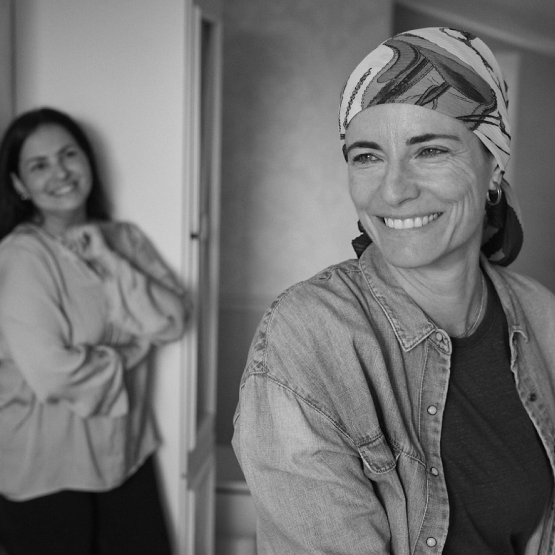 Two women smiling