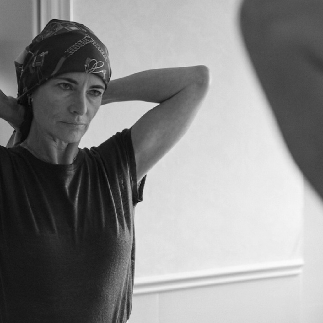 Woman looking into mirror