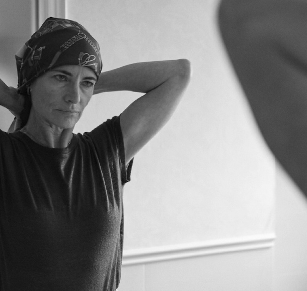 Woman looking into mirror